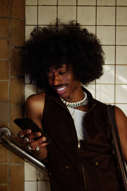 istock Young stylish man using smartphone in subway station 2197789538