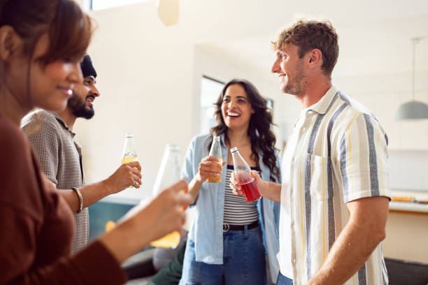 istock Group of Friends Socializing During a Relaxed Home Gathering 2197791046