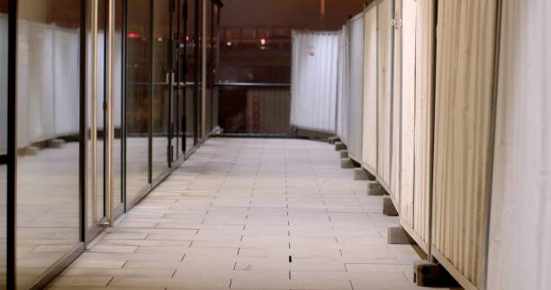 istock A modern corridor featuring glass panels illuminated beautifully at night 2197793080