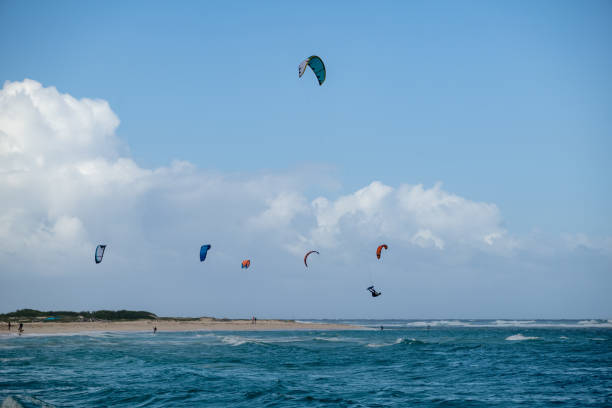 istock Exciting Kiteboarding Adventure on a Windy Beach with Colorful Kites 2197800861
