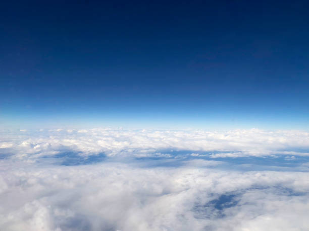 istock Aerial View of Clouds and Blue Sky from Airplane 2197804064
