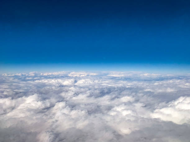 istock Aerial View of Clouds and Blue Sky from Airplane 2197804069