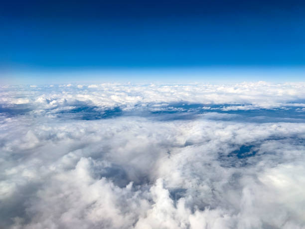 istock Aerial View of Clouds and Blue Sky from Airplane 2197804076