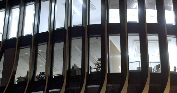 istock A commercial building with many windows is beautifully lit at night 2197804242