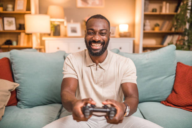 istock A carefree black man is having crazy fun playing video games with a joystick 2197804407