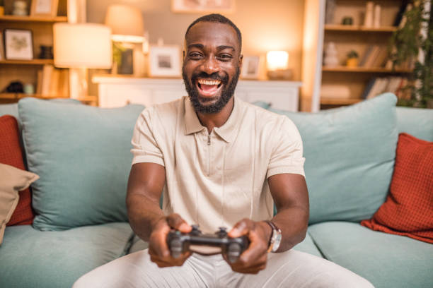 istock A happy black man is having crazy fun playing video games with a joystick 2197804482