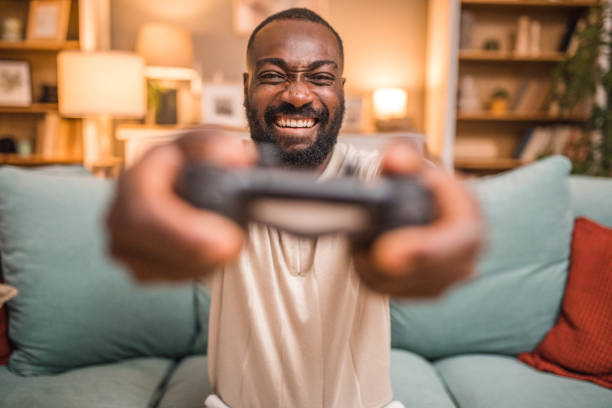istock A smiling black man is having crazy fun playing video games with a joystick 2197804498