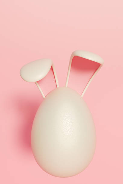 istock Easter egg with bunny ears on a pink background, symbolizing the festive spirit. 3d rendering 2197806017