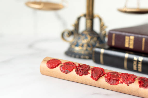 istock Seven seals scroll with holy bible book and ancient balance scale in the background 2197808535