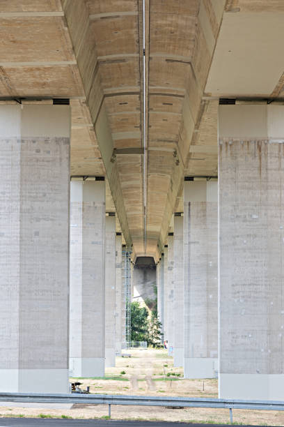 istock Concrete highway bridge structure photographed from below with pillars 2197808791