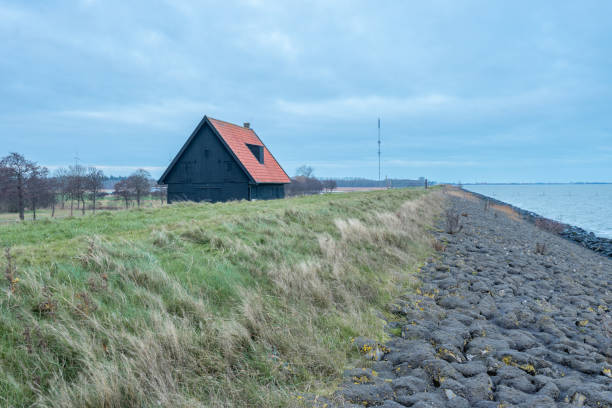 istock Old barn at the coast of Wieringerwerf, The Netherlands. 2197808853