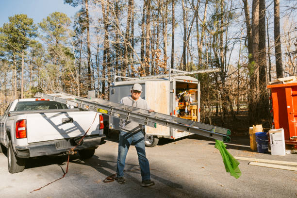 istock Construction worker repairing a house siding 2197811535