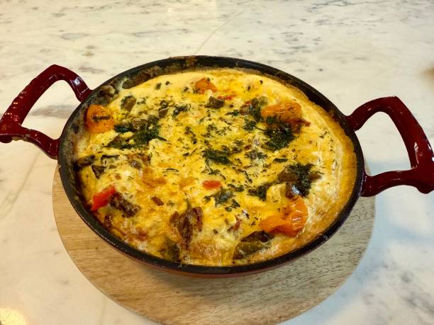 istock Italian Frittata made with spinach, tomatoes, onion and peppers 2197811668