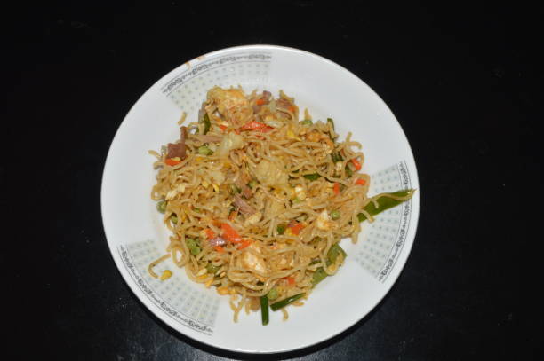 istock Stir Fried Noodle with Vegetables and Seafood on Plate 2197811812