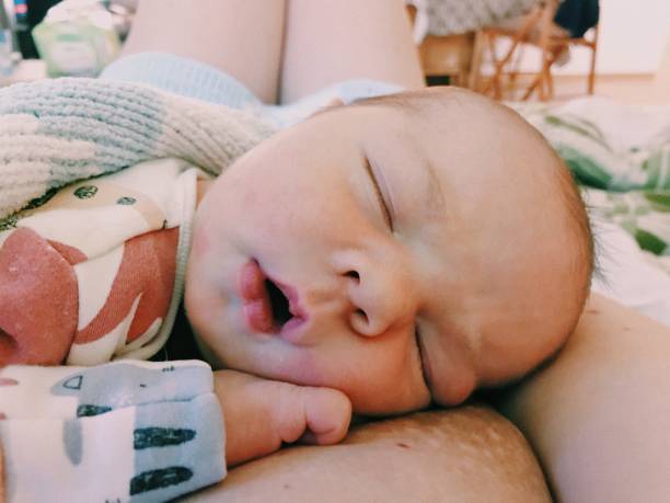 istock Babies. Newborn baby captured on smartphone. Child first days. 2197811933