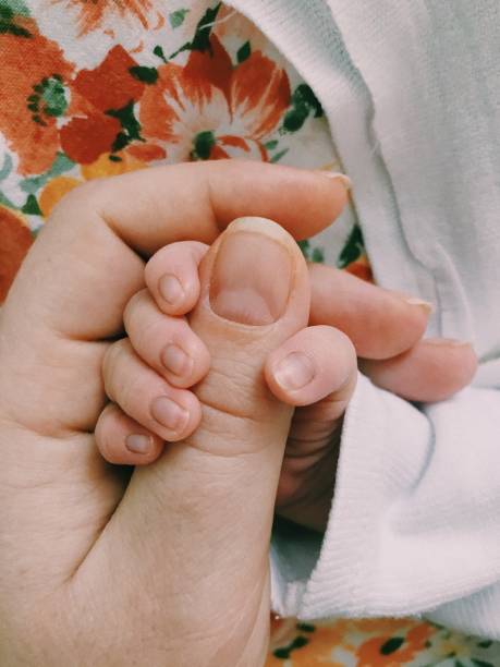 istock Babies. Newborn baby captured on smartphone. Child first days. 2197812028