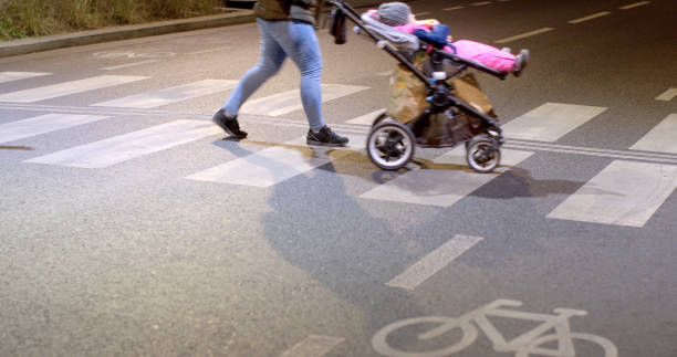 istock An individual is pushing a stroller that has a baby sitting inside it 2197813440