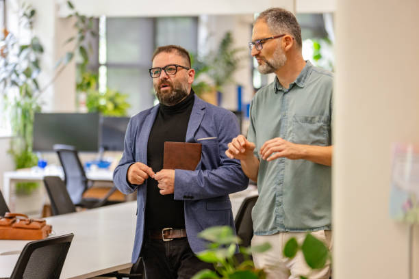 istock Business professionals discussing strategy in an office setting in Sydney, Australia 2197813925