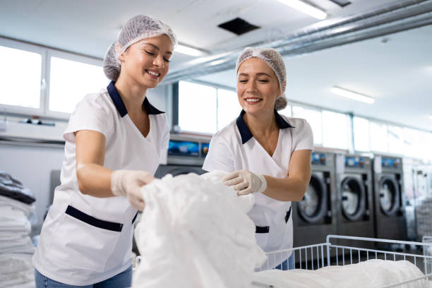 istock Working in hospital laundry service. 2197814283