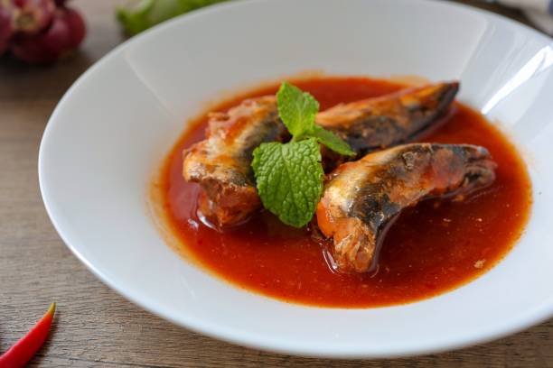 istock Sardines in tomaro sauce ,canned fish,Tinned fish in a white plate 2197815422