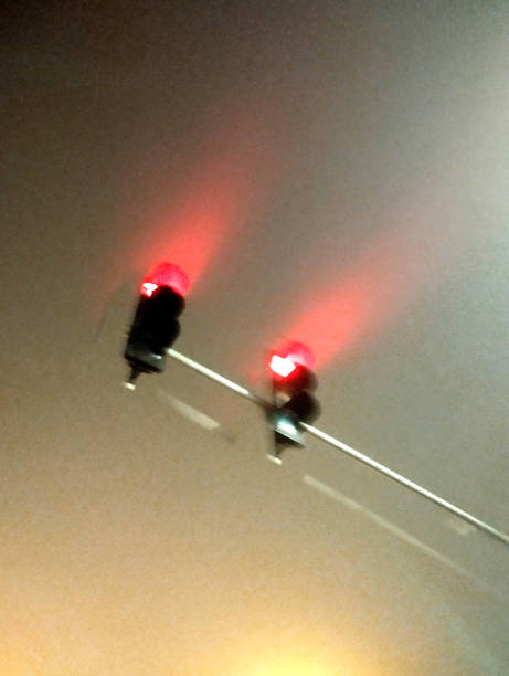 istock Red Traffic Light in Foggy Weather 2197815611