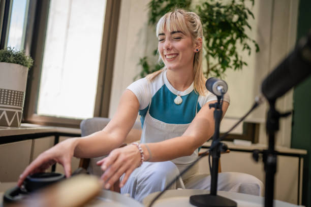 istock Engaging podcast host in a modern studio setting during a recording session in Sydney, Australia 2197817592