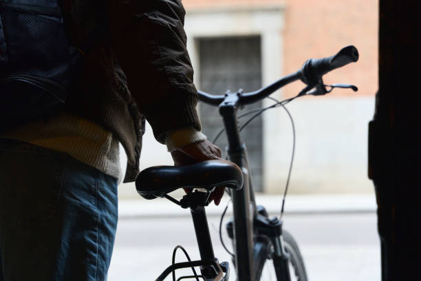 istock Student holding his bicycle getting ready to go to university 2197817748