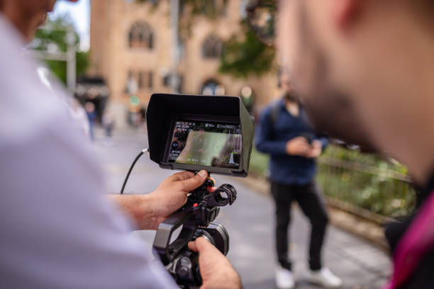 istock Filmmaker capturing footage in Sydney's bustling streets during daytime activity 2197818471