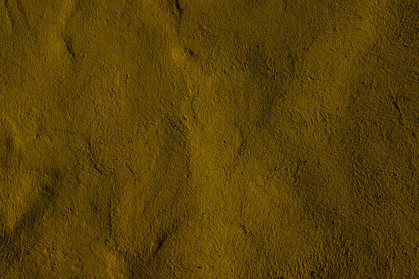 istock Yellowish Wall Surface Texture Background with Crumbled Pattern and Natural Look 2197820595