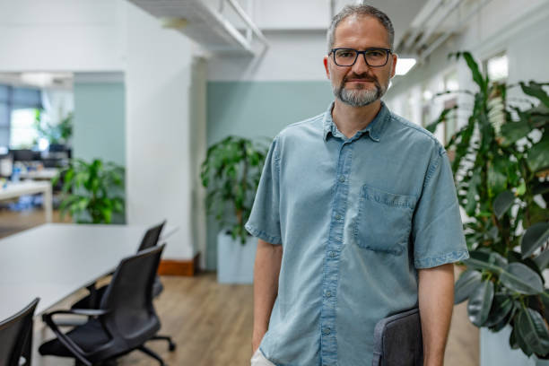 istock Professional man in an office setting in Sydney surrounded by indoor plants and modern workspace features 2197821654