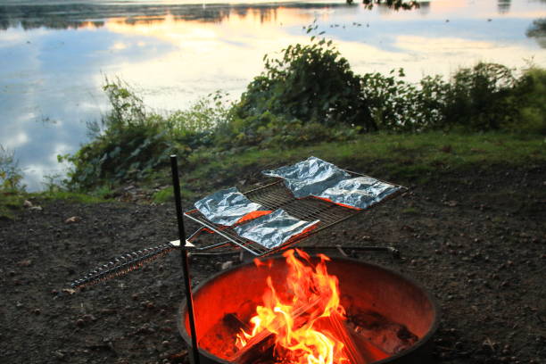 istock Cooking Foil Packs Over An Open Fire At The Campsite 2197823024