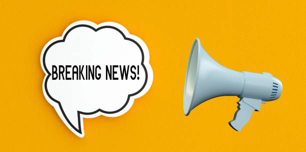 istock Breaking news text message on speech bubble.Megaphone and announcement concept,yellow background. 2197823180