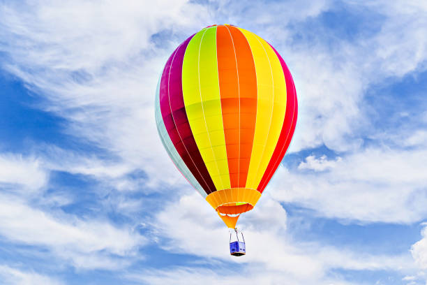 istock Hot air balloon flight over blue sky 2197825478
