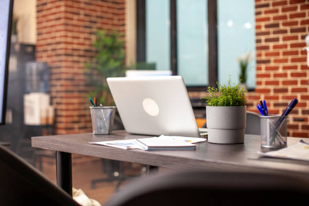 istock Vacant office desk with laptop 2197826398