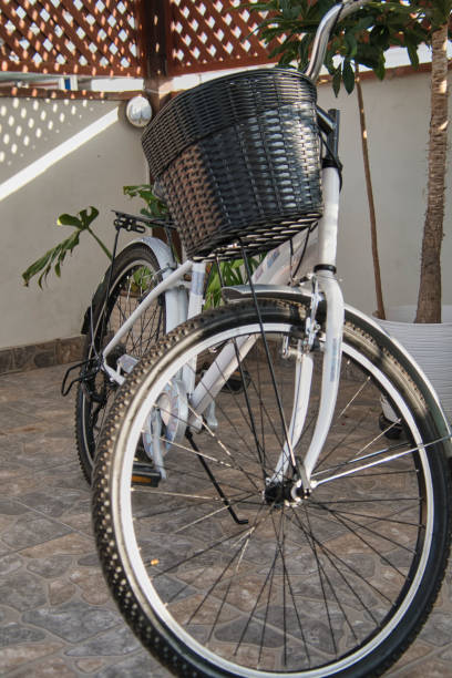 istock White bicycle, with black basket, isolated 2197827212