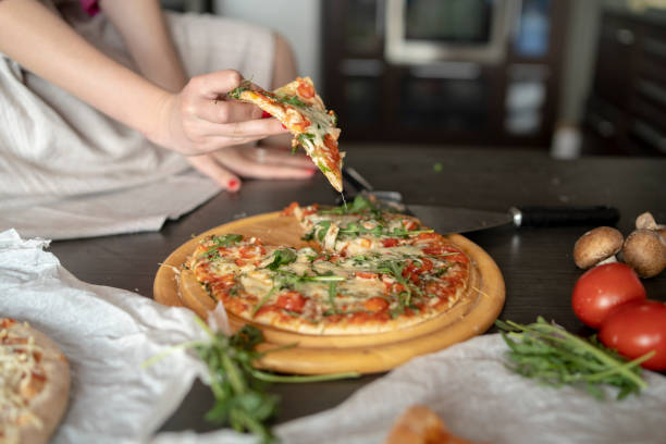 Beautiful young woman with pizza