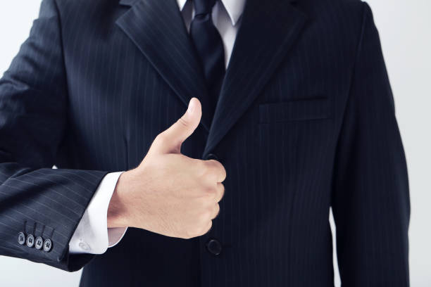 istock Businessman gesturing with his hand on grey background 2197832671