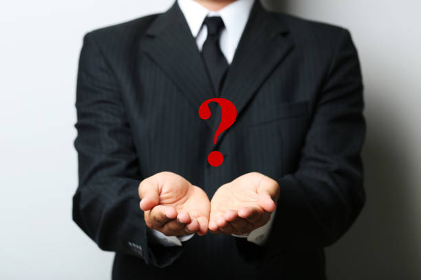 istock Businessman gesturing with his hands on grey background 2197833085