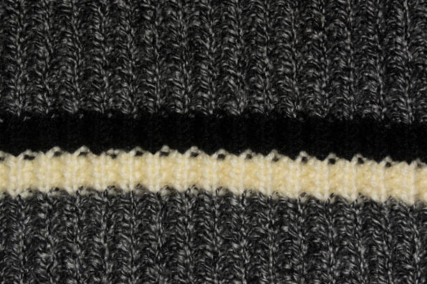 istock Dark grey knitted knitted fabric with white and black stripe 2197834840