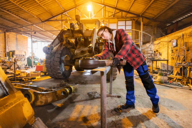 istock Skilled Technician Repairing Excavator in Workshop 2197837212