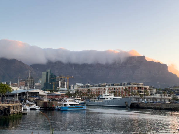 istock Cape town waterfront at sunset, South Africa. Yachts at harbor, Clouds over Table mountain summit 2197839202