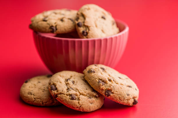 istock Chocolate chip cookies on red background. 2197840226