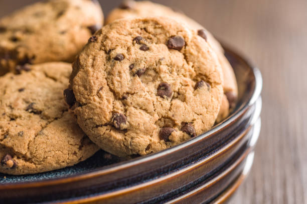 istock Chocolate chip cookies on plate on wooden table. 2197840478