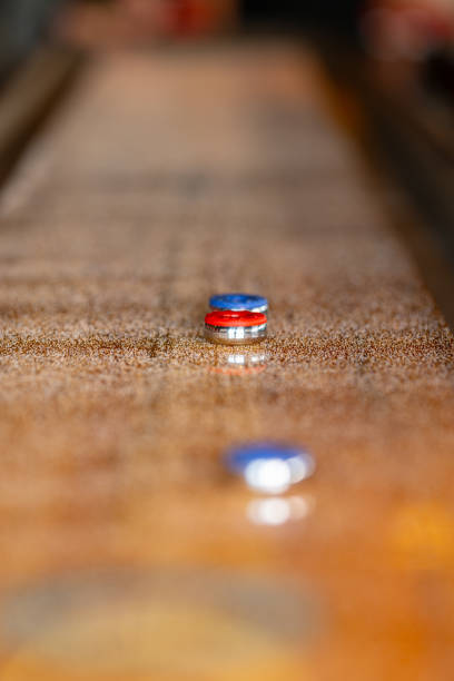 istock Playing a game of shuffleboard.. 2197842402