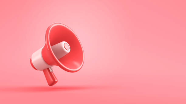 istock Single red electric megaphone with a handle stands on a pink background 2197845923