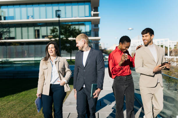 istock Diverse business team walking outdoors together 2197849271