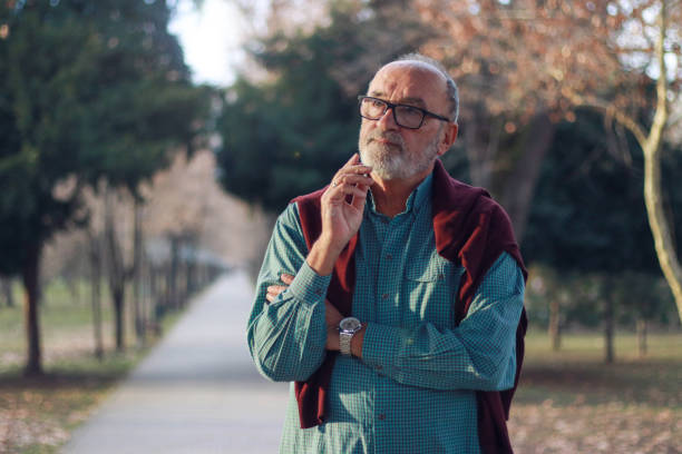 talking using mobile phone smart sunny day positive emotions bearded bold glasses casual