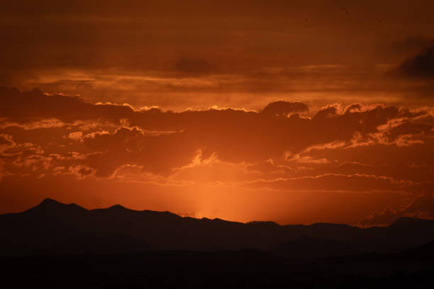 a purple sky with a purple and orange horizon and a purple cloud. Dramatic sky. Spectacular Sky at Sunset.