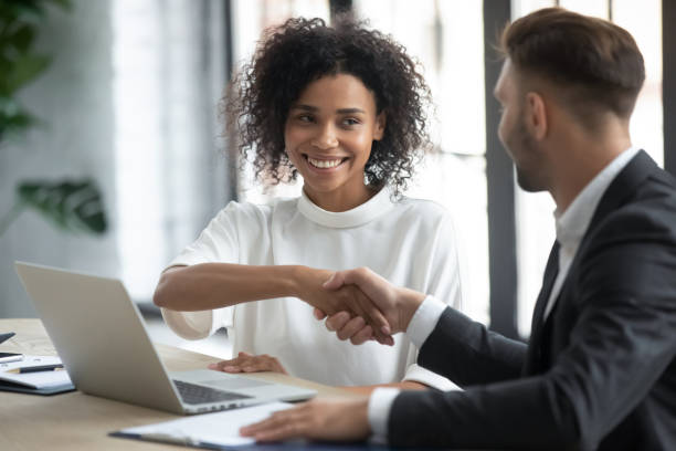 istock Smiling diverse businesspeople shake hands greeting at meeting 2197852536