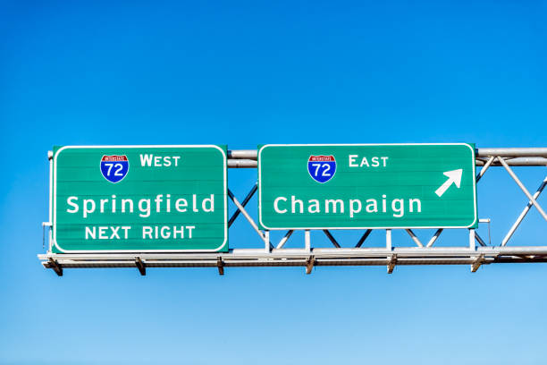 istock Highway 72 road in Illinois with sign exit east for Champaign and west for Springfield next right with blue sky background 2197857007
